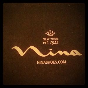 Black faux fur booties by Nina